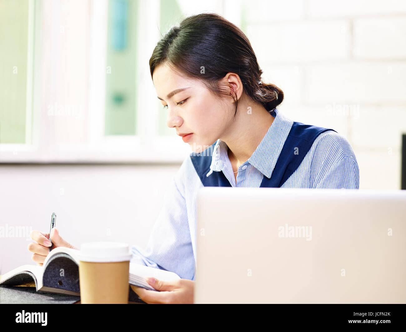 young asian businesswoman working taking notes in office Stock Photo ...