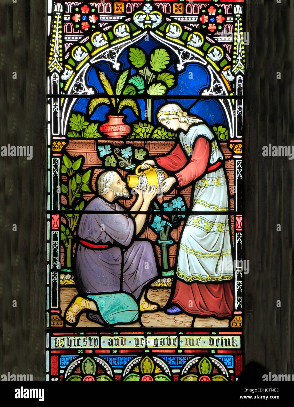 Corporal Acts of Mercy window, stained glass  by Frederick Preedy, 1868,  giving water to the thirsty, Gunthorpe, Norfolk, England, UK Stock Photo