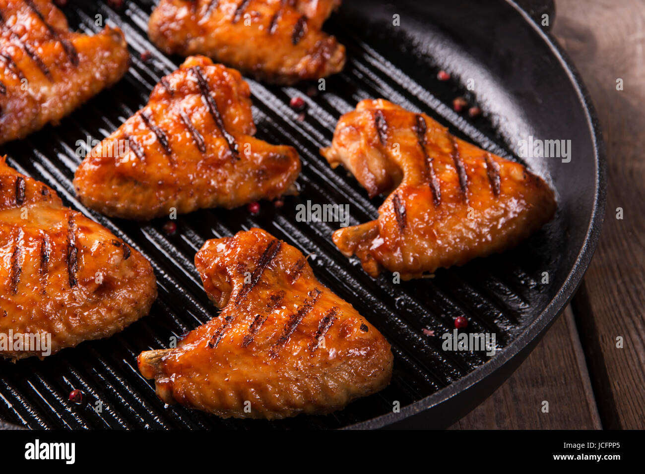 Fried chicken wings grill on grill pan Stock Photo Alamy