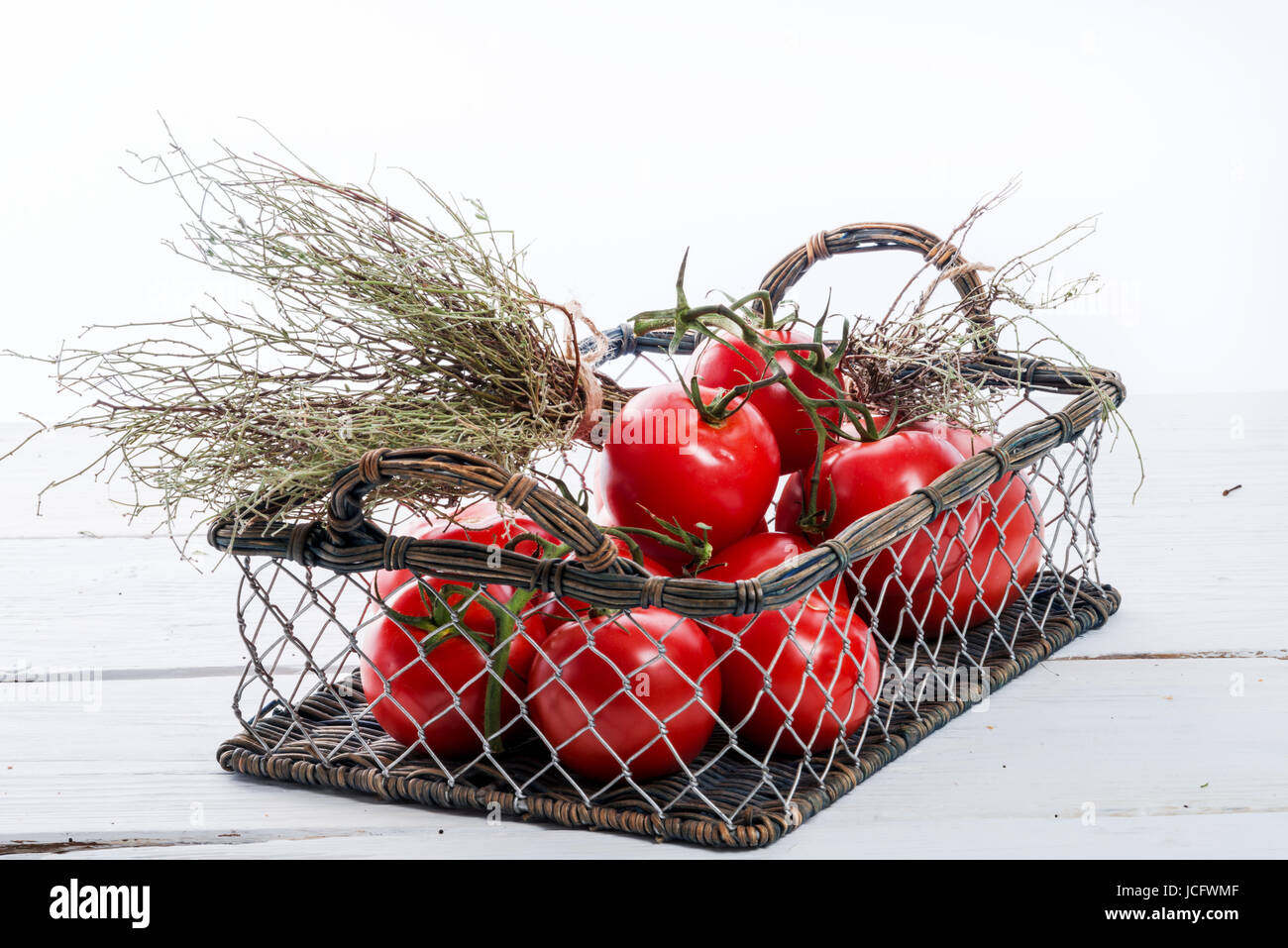 tomatoes in the basket Stock Photo Alamy