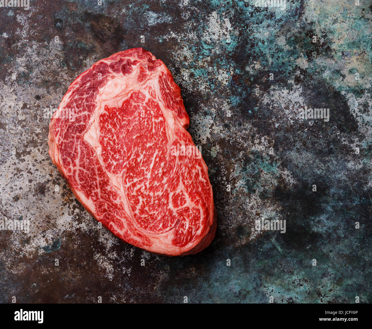 Raw fresh marbled meat Steak Ribeye Black Angus on metal background Stock Photo