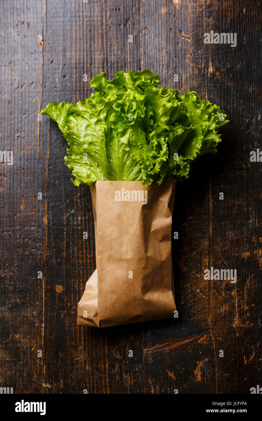 Fresh Green salad lettuce in paper bag on wooden background Stock Photo Alamy