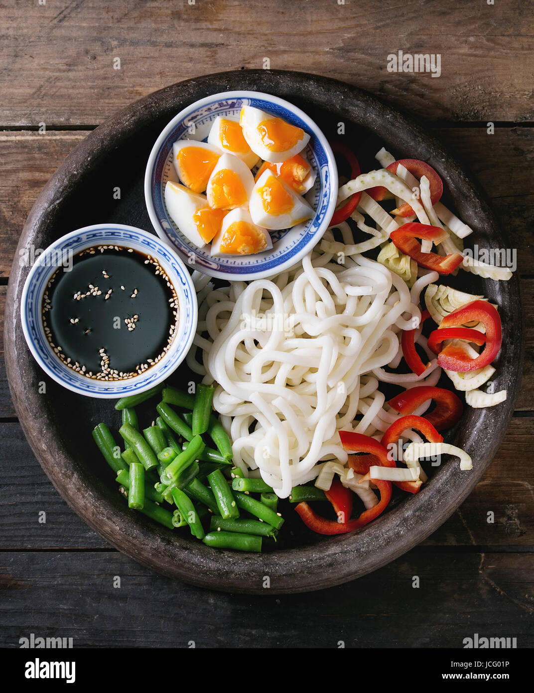Ingredients for cooking stir fry udon noodles, green beans, sliced