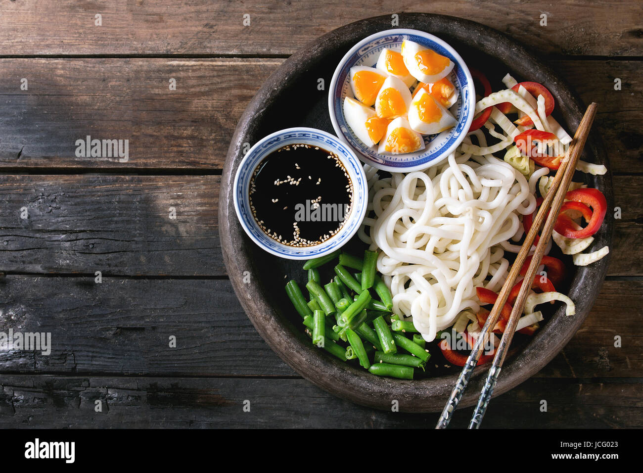 Ingredients for cooking stir fry udon noodles, green beans, sliced