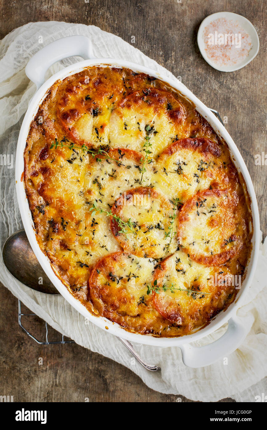 Wild Rice Kale Tomato Casserole with a Cheddar Cheese Sause served with