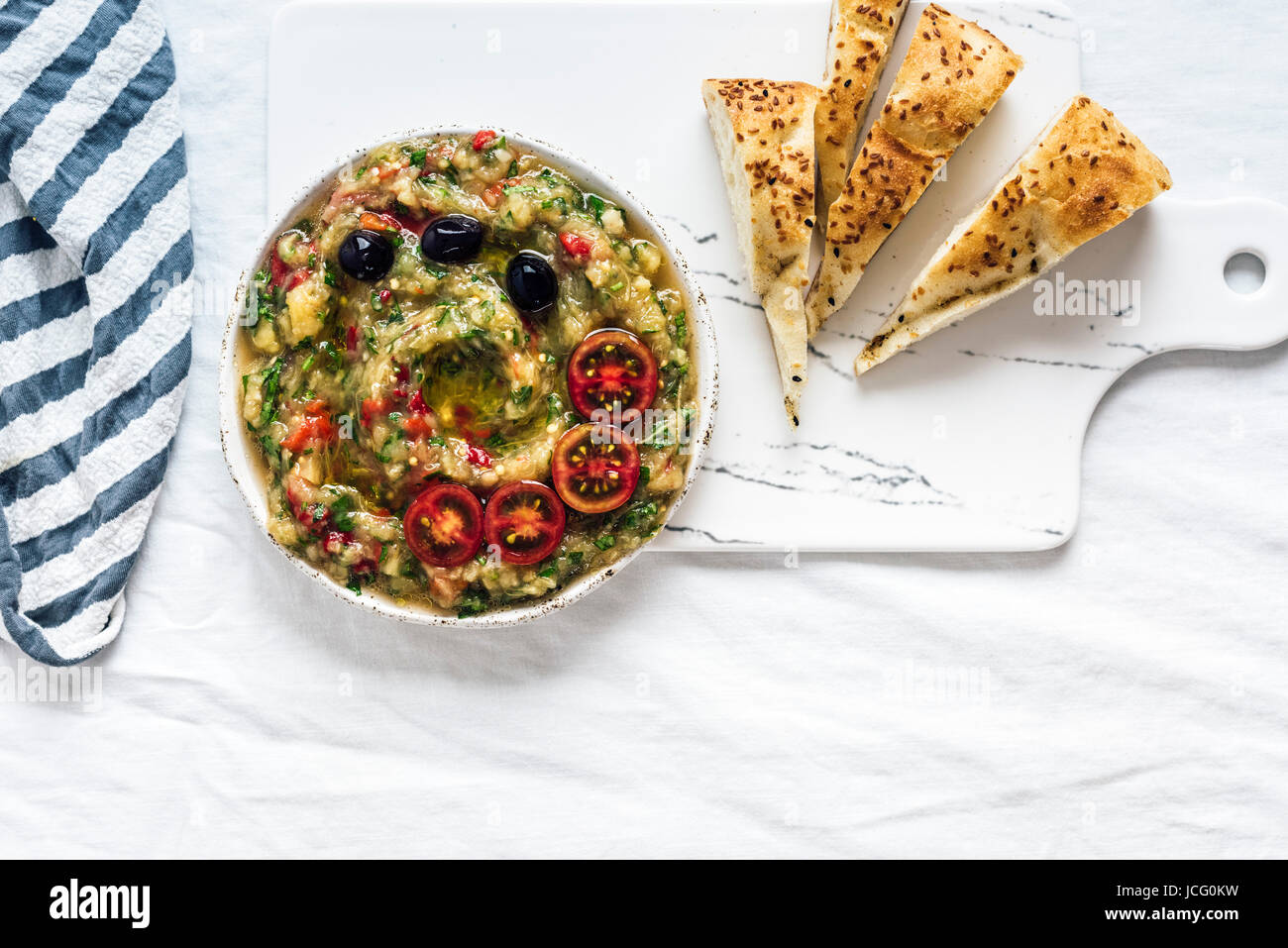 Baba ganoush made with roasted eggplant, red bell pepper and herbs but