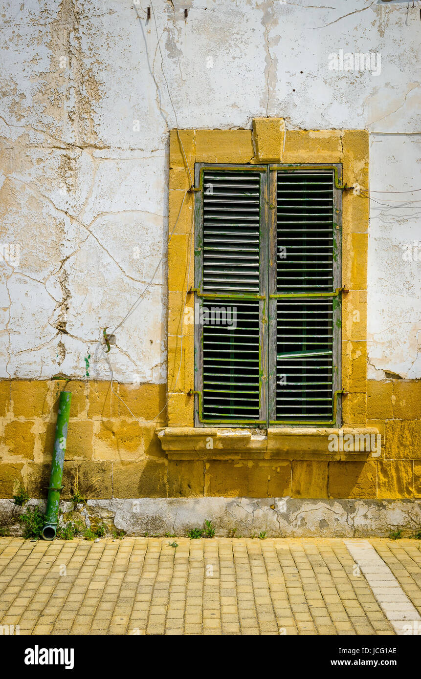 Wooden window shutters on a building in the Turkish northern half of