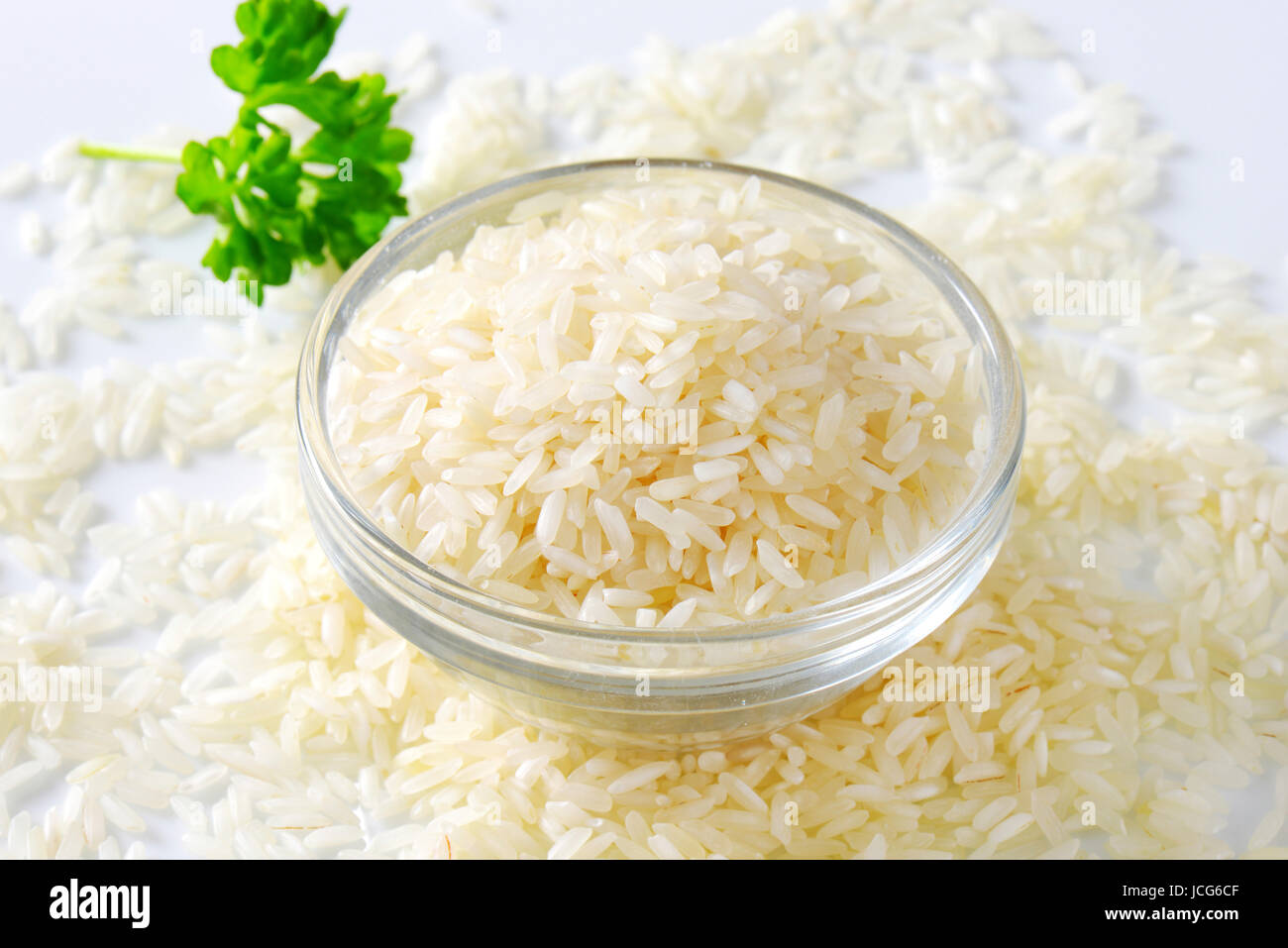 Bowl of uncooked white rice Stock Photo Alamy