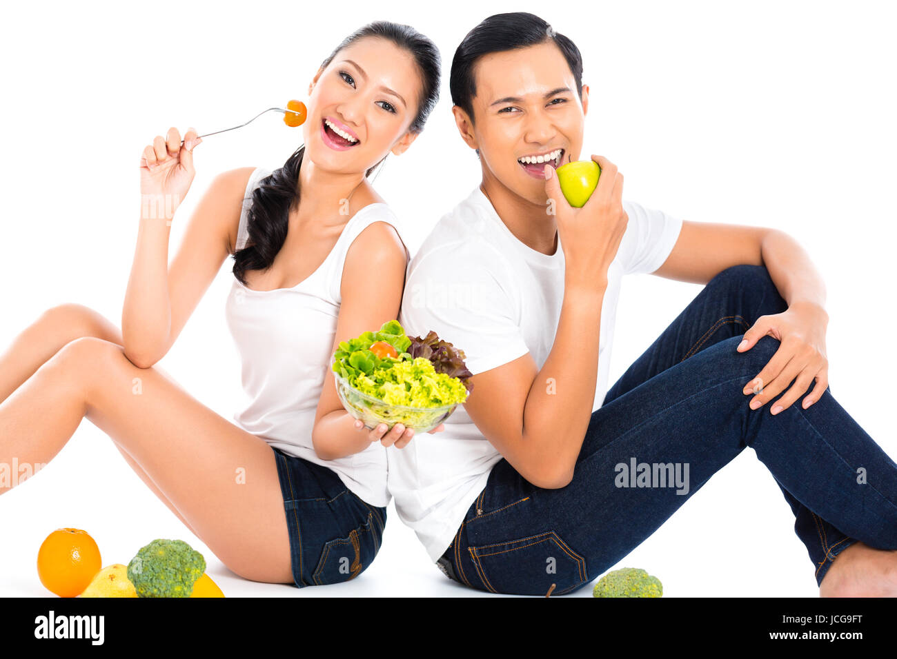 Asian couple eating salad fruit and vegetables Stock Photo - Alamy
