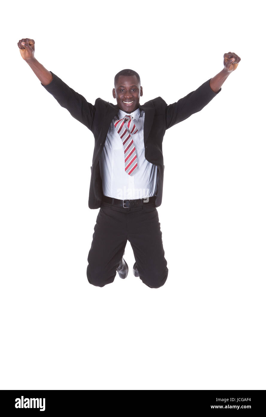 Portrait Of Excited Young Businessman With Hand Raised Stock Photo - Alamy