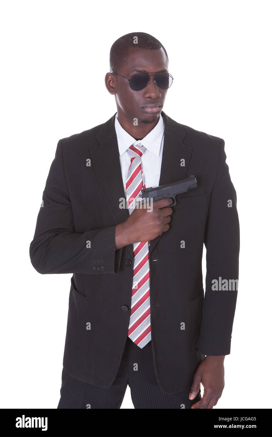 Portrait Of Young Handsome Man With Black Sunglasses And Gun Stock ...