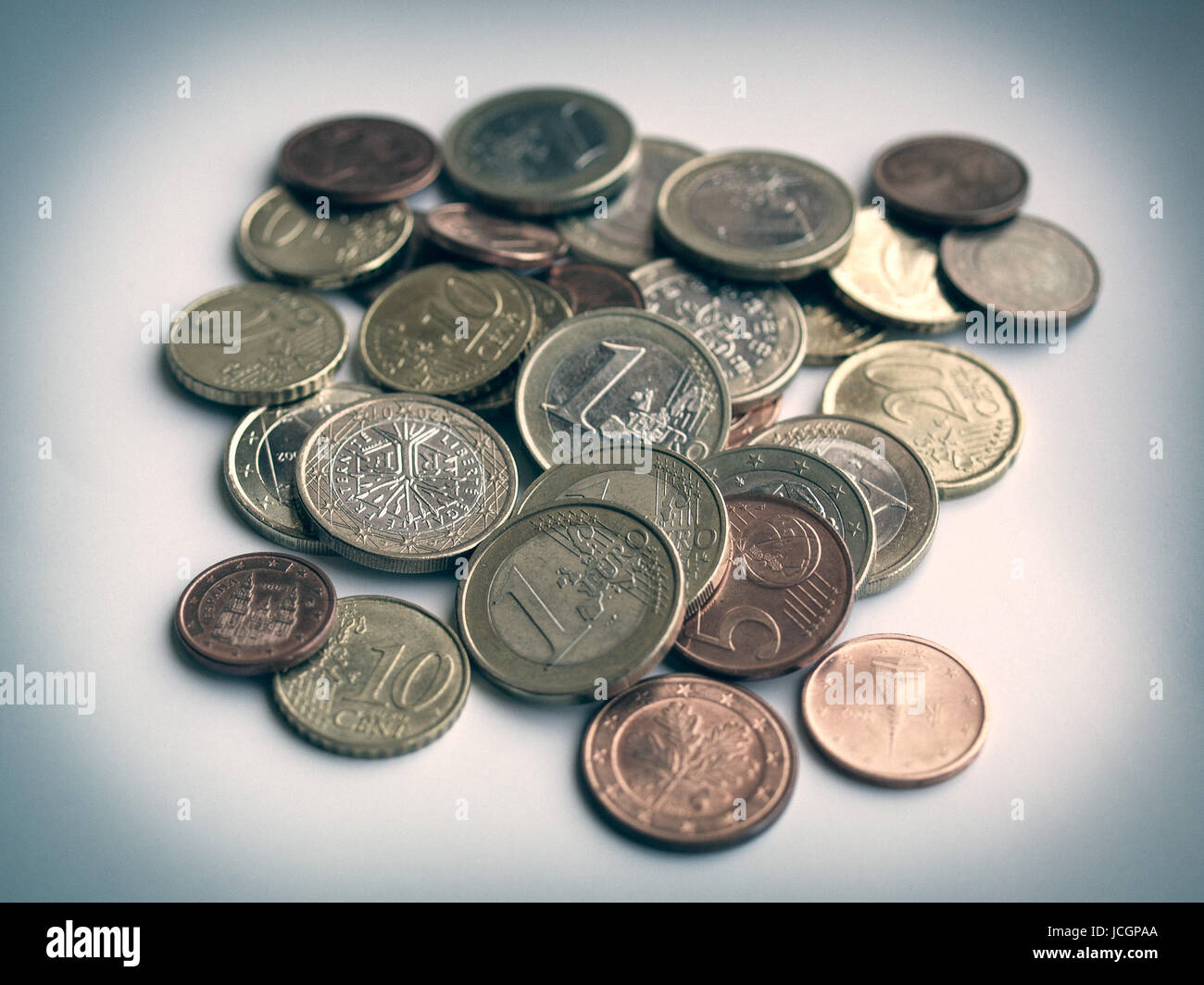 Vintage looking Euro coins money on light blue background Stock Photo ...