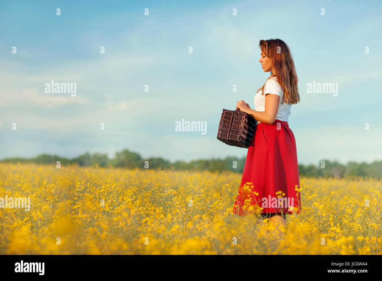 The girl in the profile. It stands on the field. Field of yellow ...