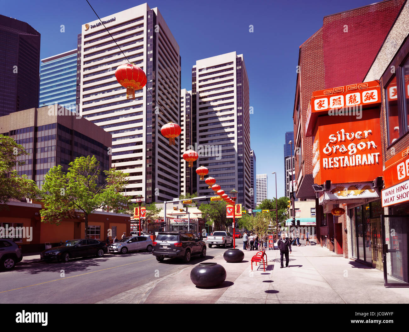 License and prints at MaximImages.com - Silver dragon restaurant bright red sign and other shops in Chinatown of Calgary, Alberta, Canada Stock Photo