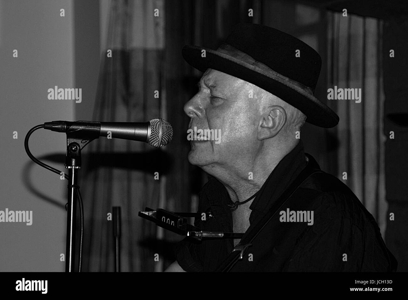 Dave Sharp, former lead guitarist with The Alarm, during a solo acoustic performance at The Village Inn, East Kilbride. Stock Photo