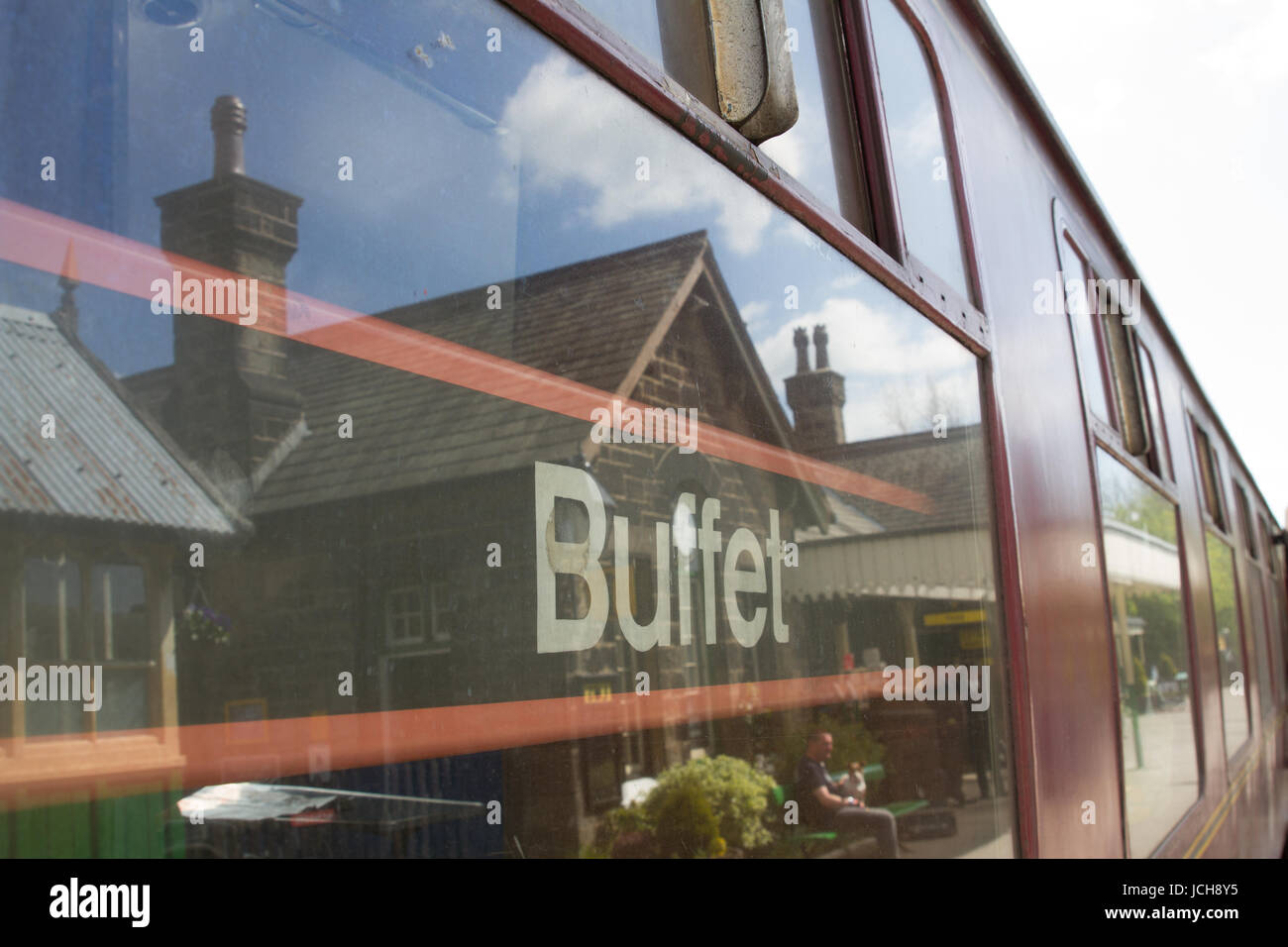 Embsay and Bolton Abbey Railway Buffet Car with the Railway Station Buildings reflection in the window. Stock Photo