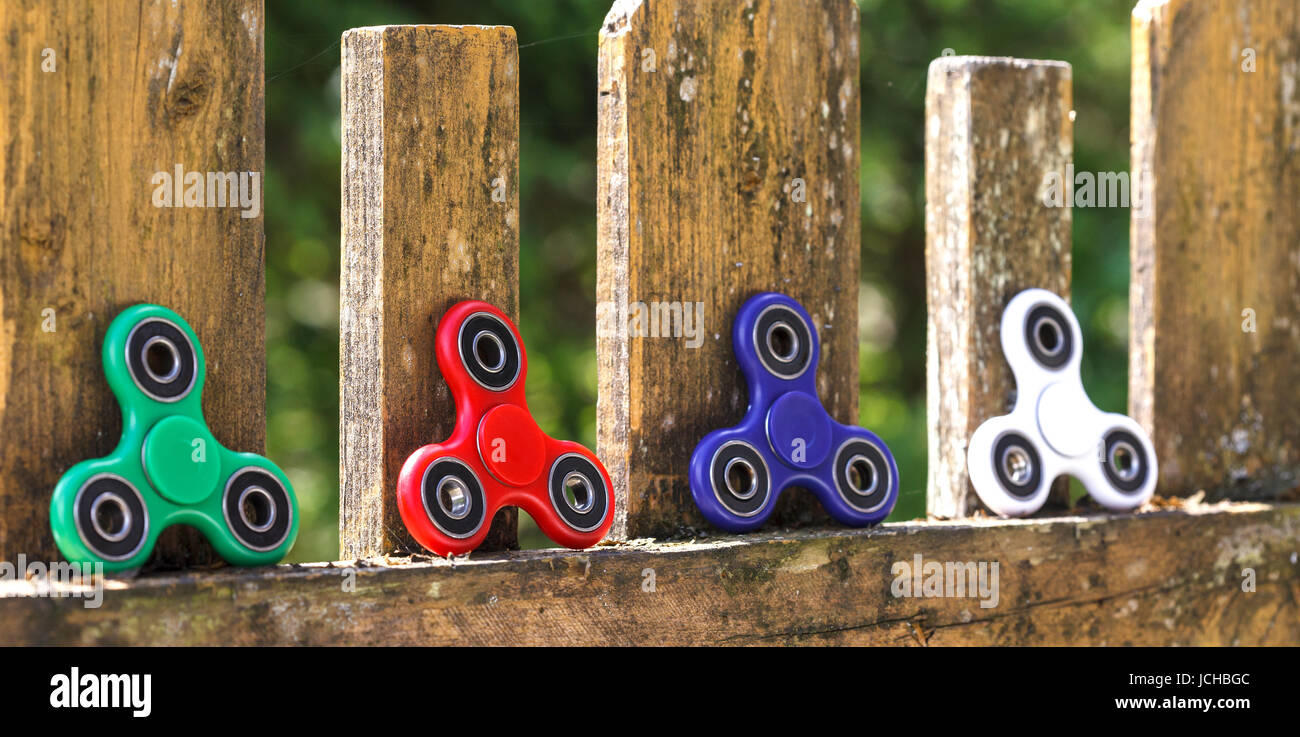 Anti stress and relaxation fidgets, spinner for exhausted people Stock Photo