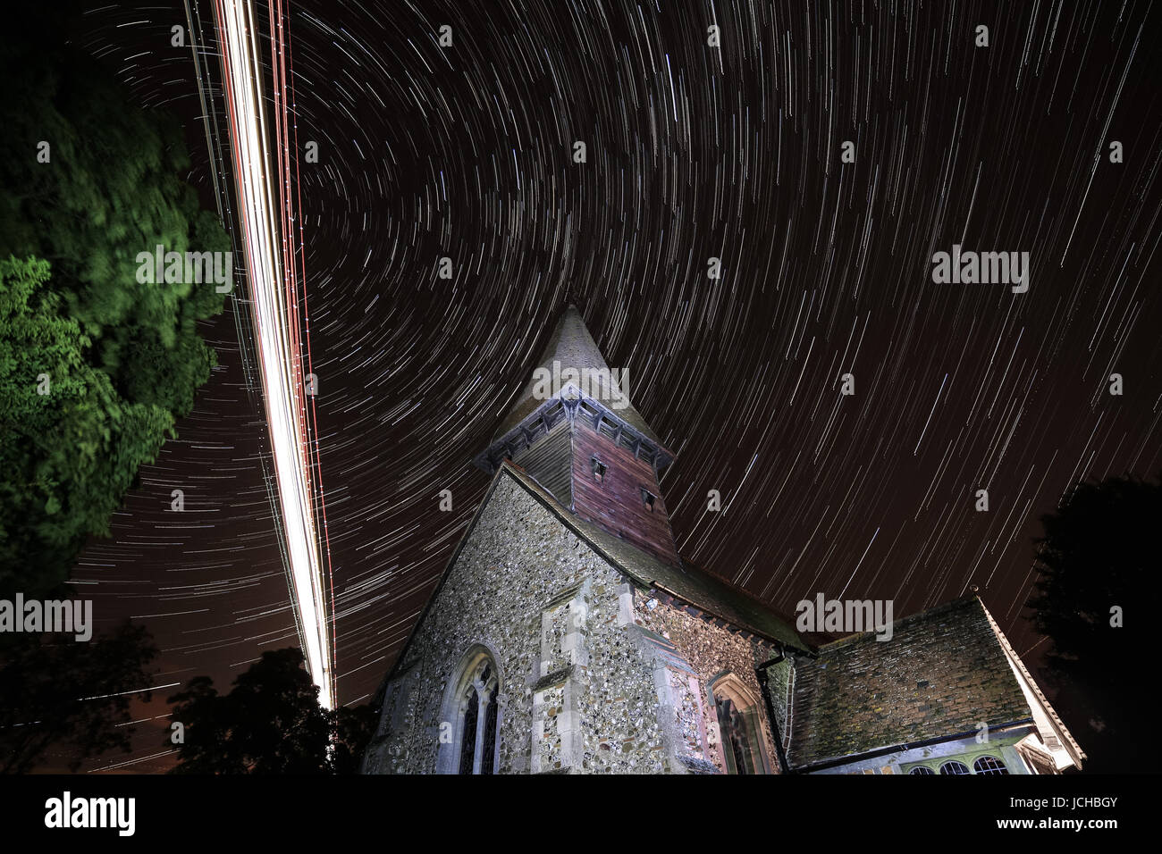 broxted church, essex, england, uk flight path planes to stansted airport long exposure photography Stock Photo