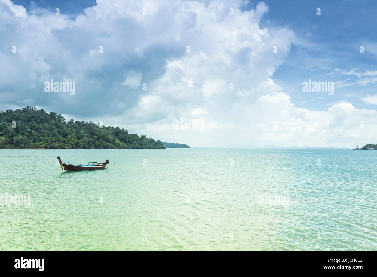 Seascape and fishing boat with blue sky Stock Photo - Alamy