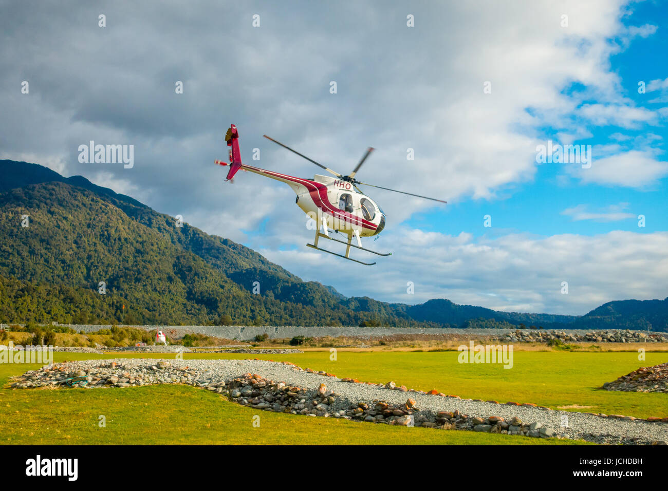 SOUTH ISLAND, NEW ZEALAND- MAY 25, 2017: A helicopter lifting off ready to take tourists to a glacier in the South Island of New Zealan. Stock Photo