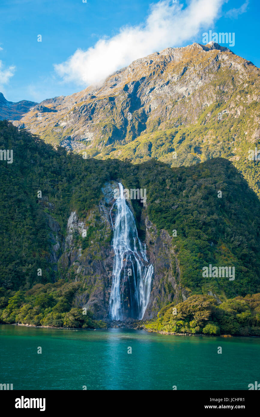 The view of a waterfall in Milford Sound, the most popular part of