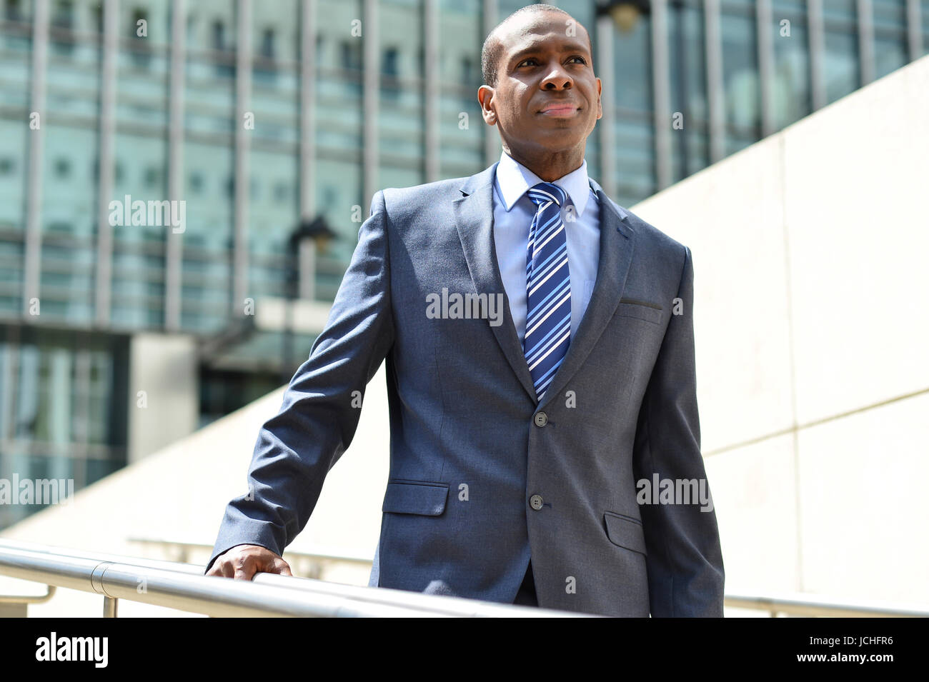 Smart man walking down steps hi-res stock photography and images - Alamy
