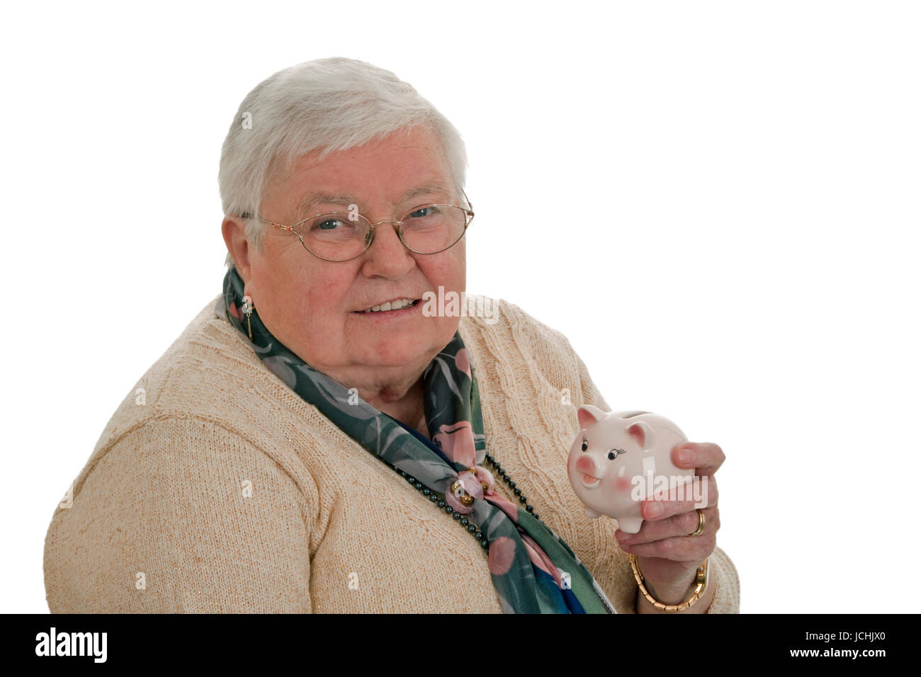 Eldery woman with piggy bank - isolated on white background Stock Photo ...