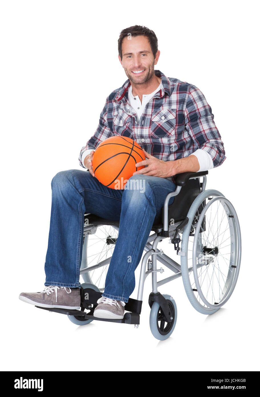 Man in wheelchair with basketball. Isolated on white Stock Photo