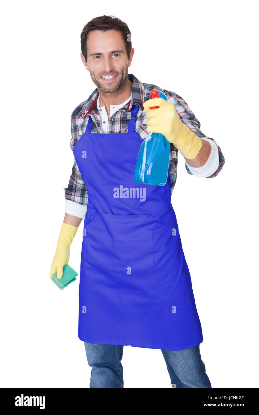 Portrait of a man with sponge and spray ready to clean windows