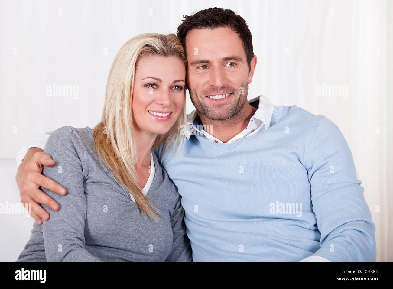 Woman arm around mans shoulder hi-res stock photography and images - Alamy