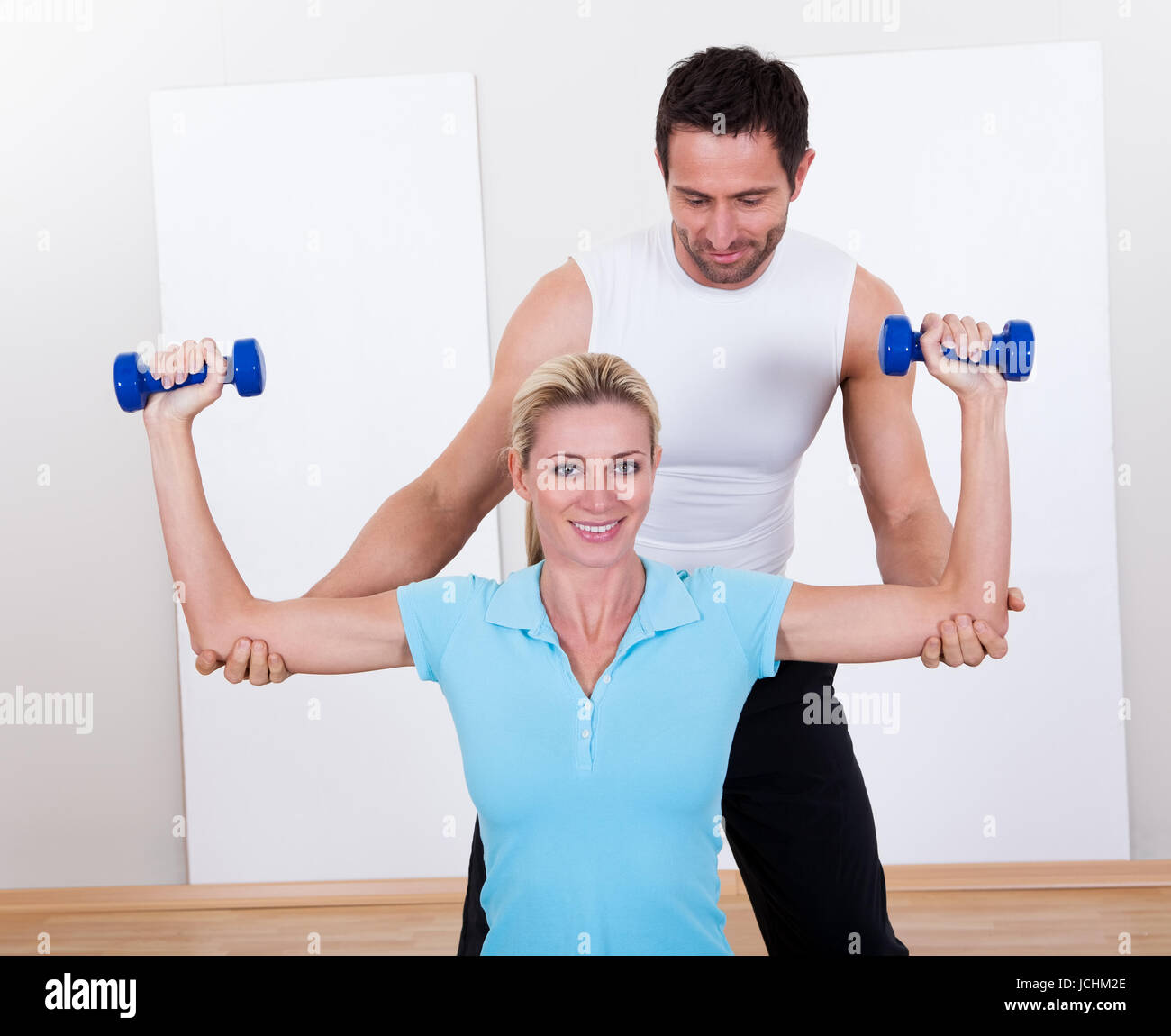 Man lifting arm guiding woman hi-res stock photography and images - Alamy
