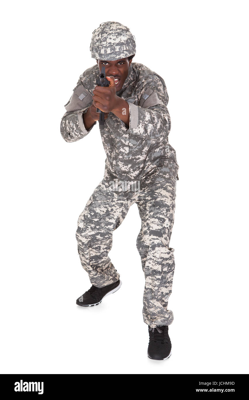 Portrait Of A Male African Soldier Aiming With Gun Isolated Over White ...