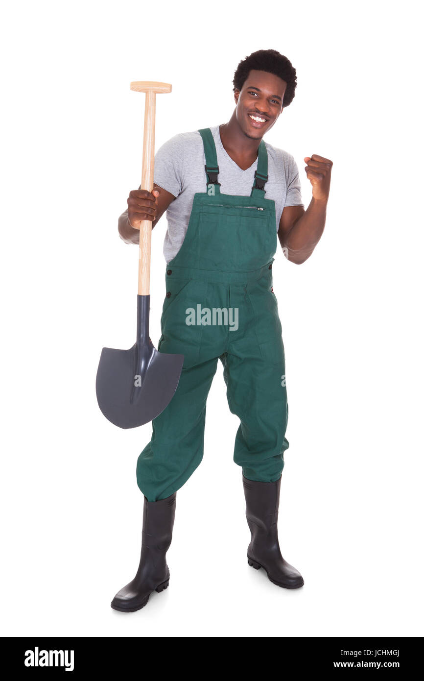 Happy Male Gardener Holding Shovel Over White Background Stock Photo ...