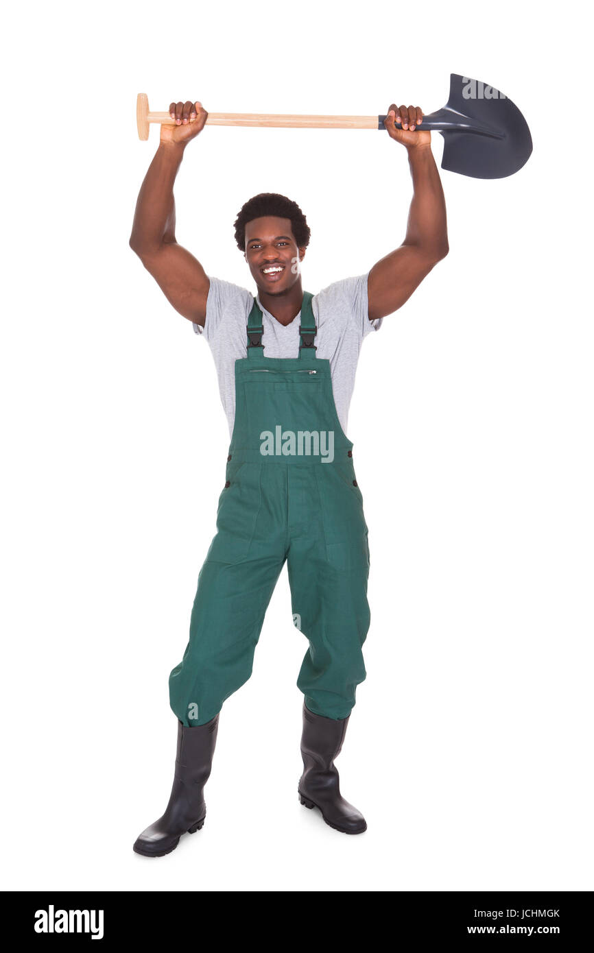 Happy Male Gardener Holding Shovel Over White Background Stock Photo ...
