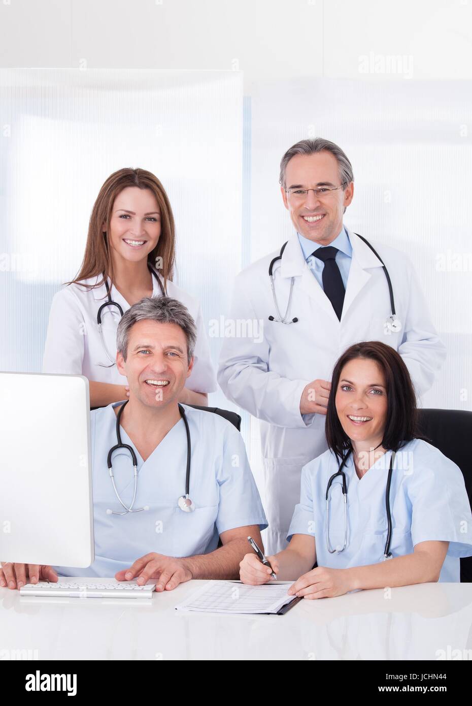 Group factory workers healthcare hi-res stock photography and images ...