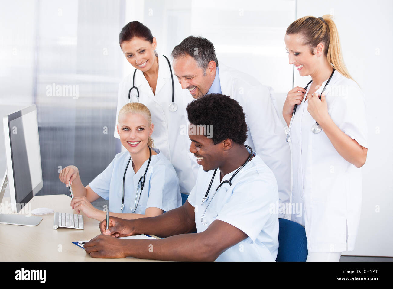 Group Of Happy Multiracial Doctors Working Together In Clinic Stock ...