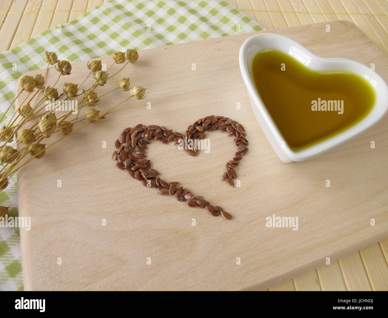 a heart of flaxseed and flaxseed oil Stock Photo Alamy