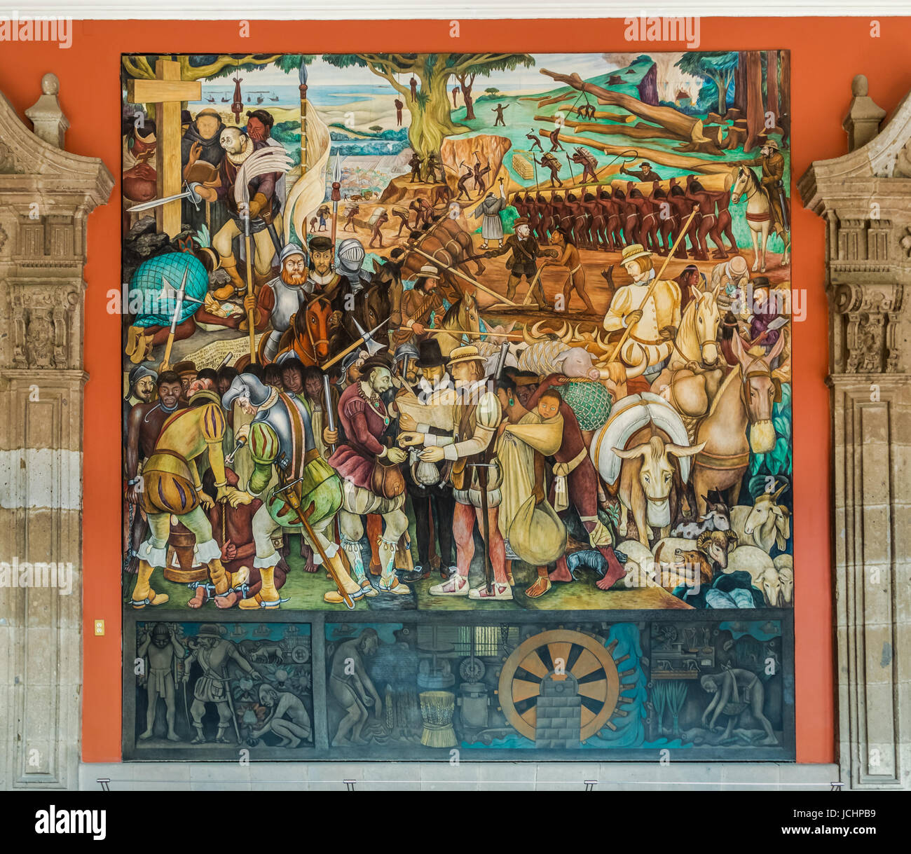 The corridor of National Palace with the famous mural "The Arrival of Cortes" by Diego Rivera
