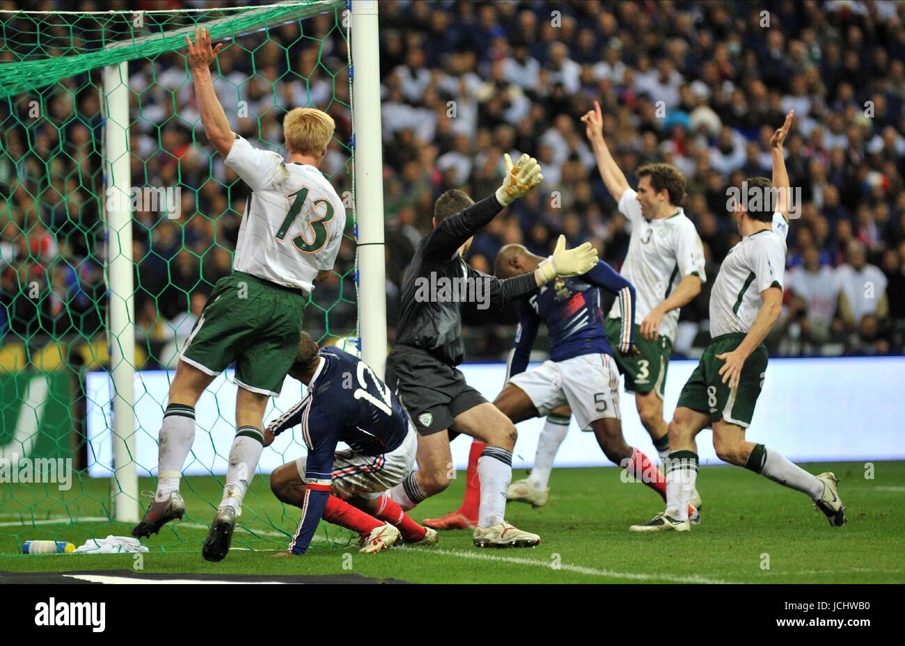 PAUL MCSHANE, WILLIAM GALLAS & THIERRY HENRY  FRANCE V REPUBLIC OF IRELAND (UK USE ONLY) FRANCE V IRELAND (UK USE ONLY) STADE DE FRANCE, PARIS, FRANCE 18 November 2009 GAB4021   HENRY APPEARED TO HANDLE THE BALL TWICE BEFORE FEEDING DEFENDER WILLIAM GALLAS, WHO BUNDLED HOME FROM CLOSE RANGE ON 103 MINUTES TO GIVE FRANCE A 1-1 DRAW IN THE RETURN LEG OF THEIR PLAYOFF AND A 2-1 AGGREGATE WIN.     WARNING! This Photograph May Only Be Used For Newspaper And/Or Magazine Editorial Purposes. May Not Be Used For Publications Involving 1 player, 1 Club Or 1 Competition  Without Written Authorisation Fro Stock Photo
