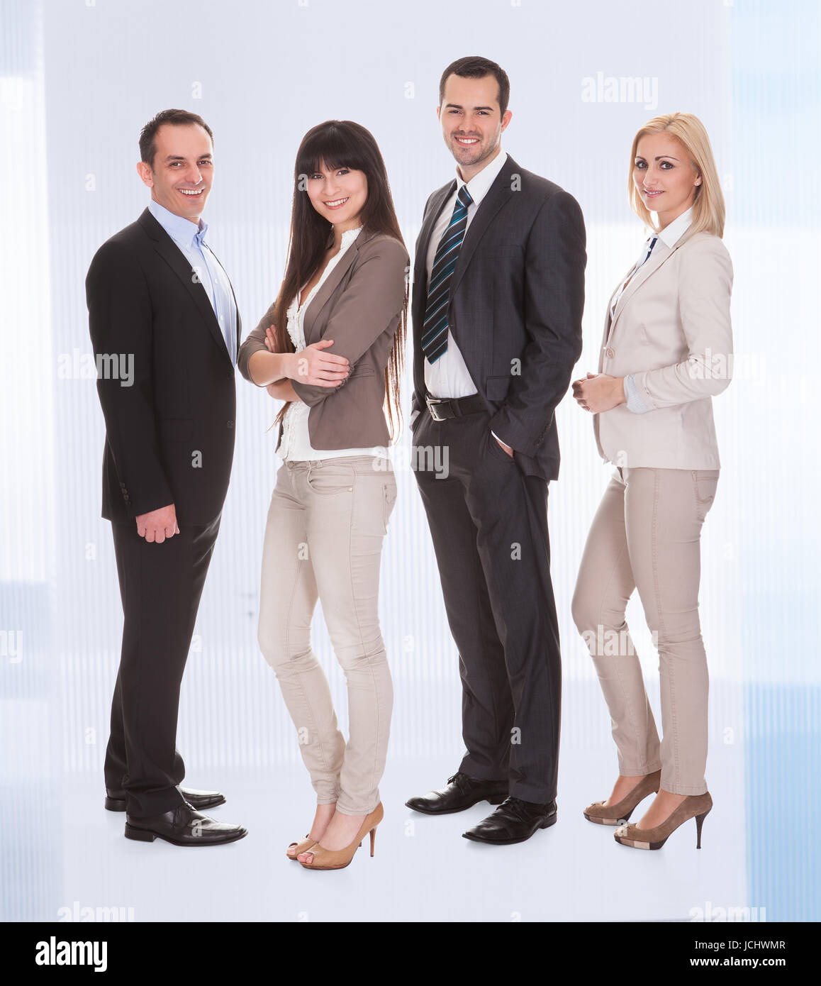 Happy Confident Businesspeople Standing Together In A Row Stock Photo ...