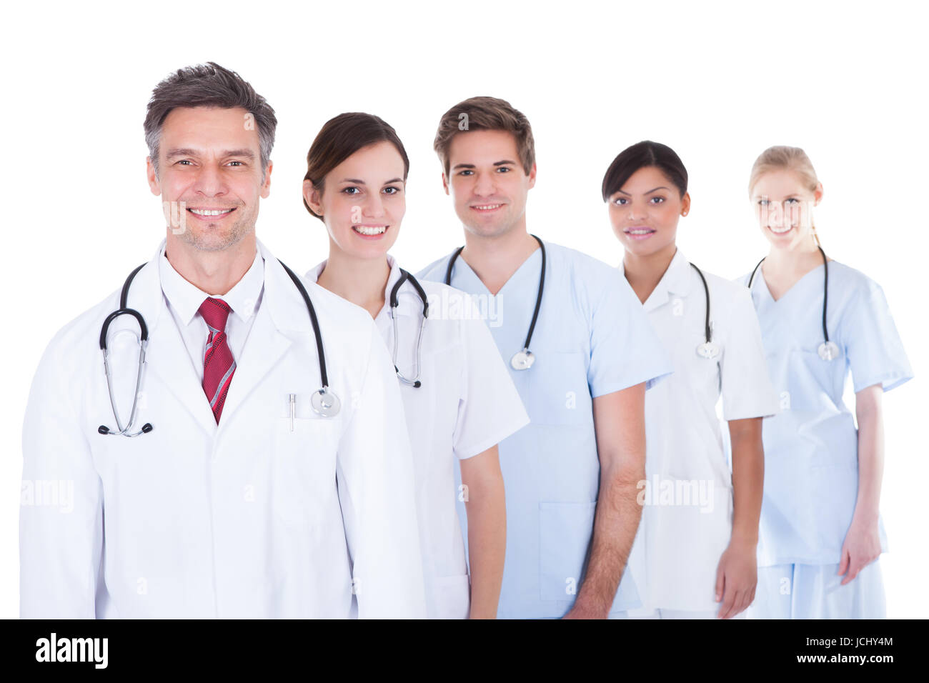 Happy Group Of Doctors And Nurses Standing In A Row Over White ...