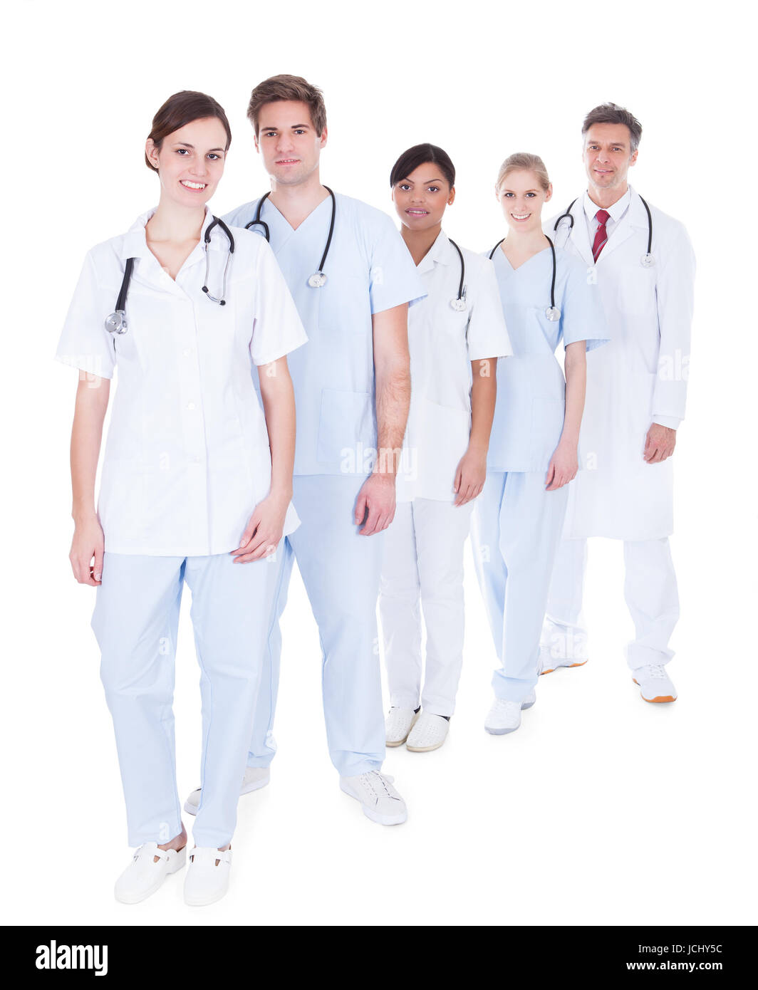 Happy Group Of Doctors And Nurses Standing In A Row Over White ...
