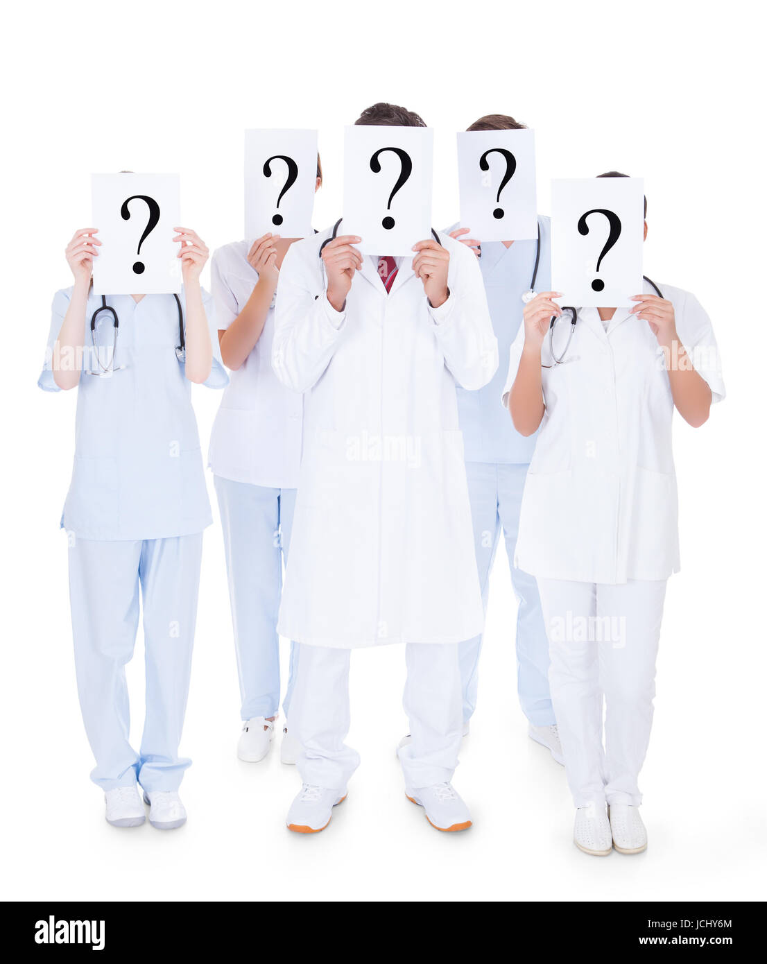 Group Of Doctors Hiding Face With Question Mark Sign Over White Background Stock Photo