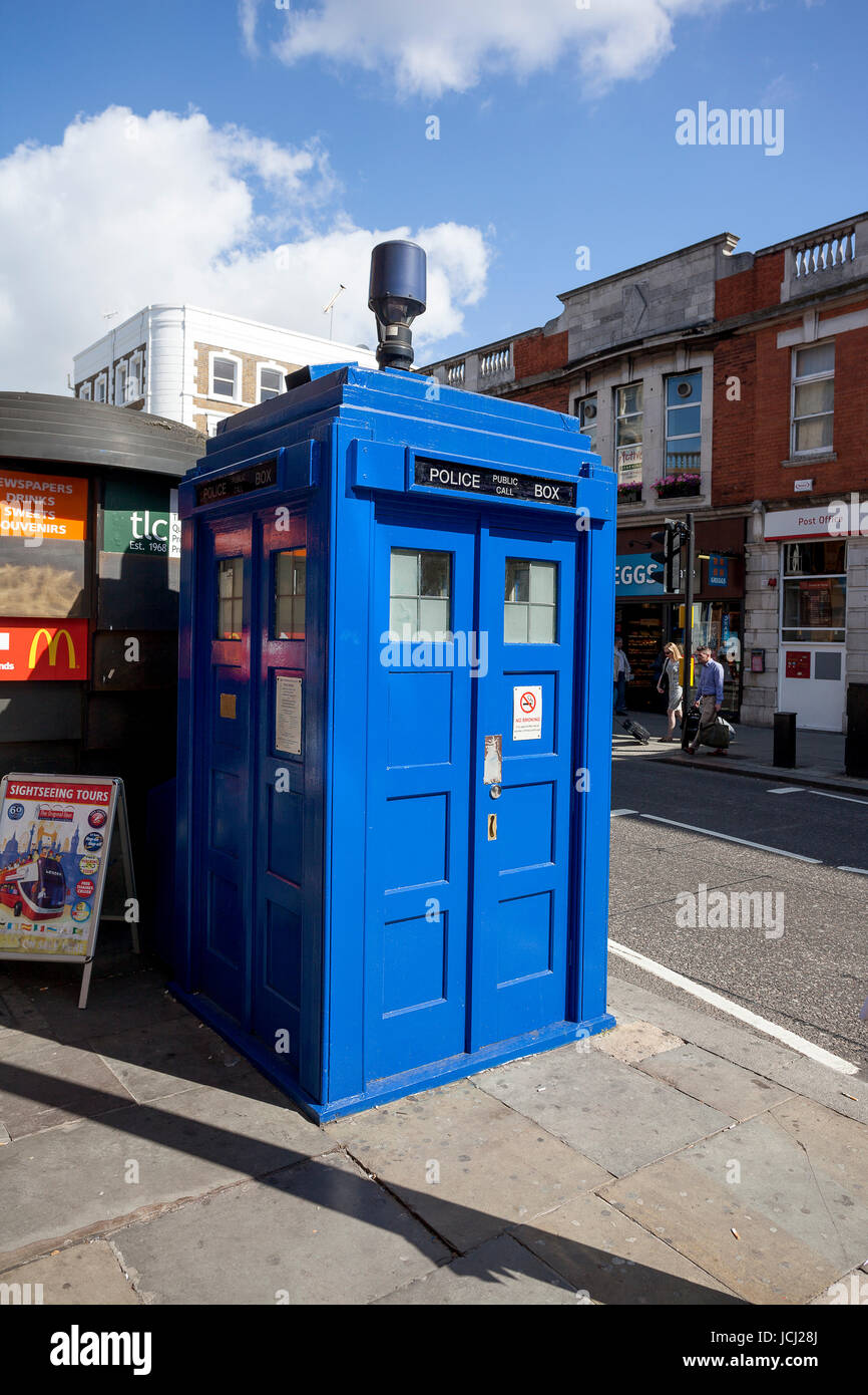 LONDON - JUNE 11, 2014: Public call police box with mounted a modern ...