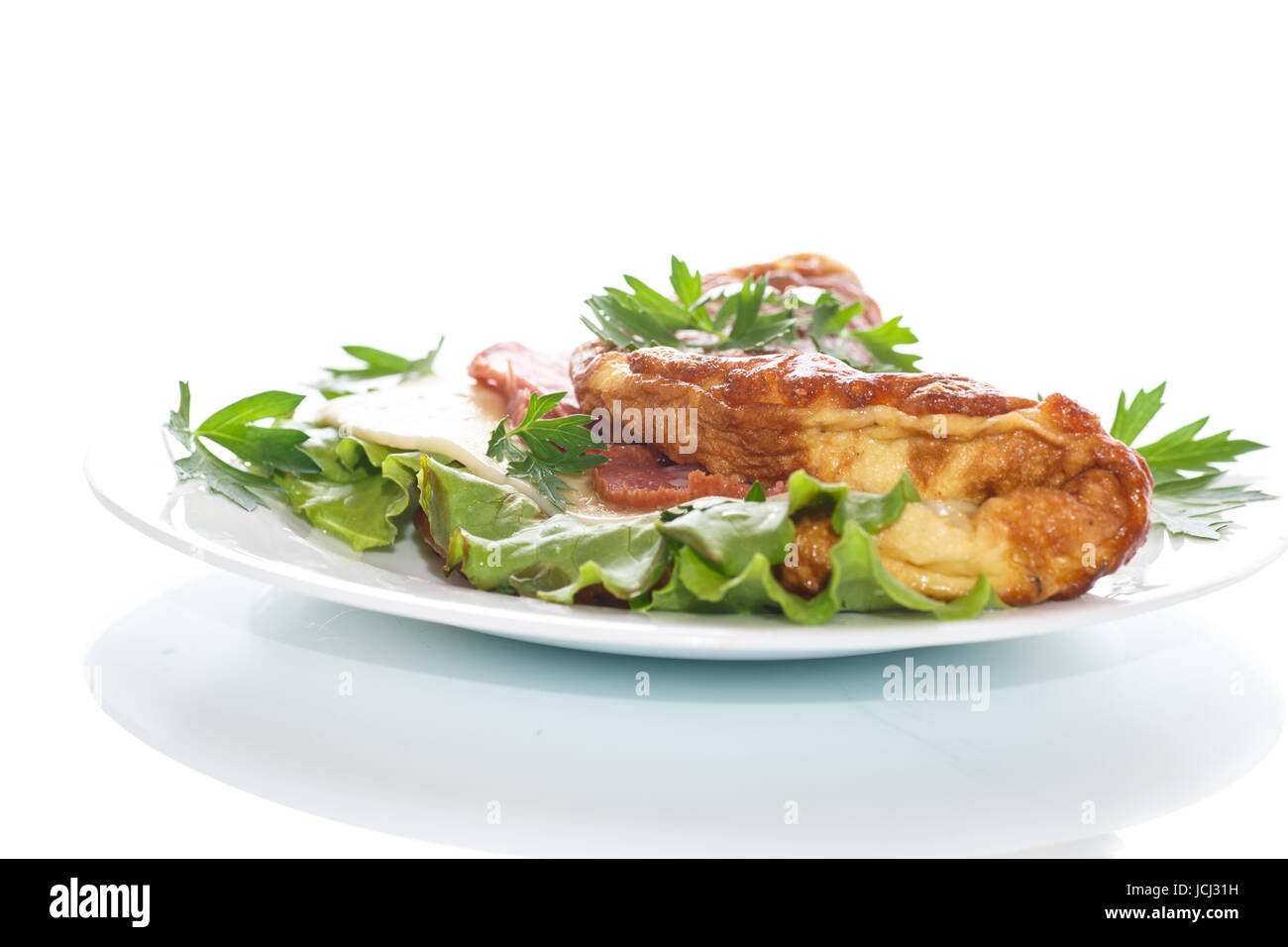 scrambled eggs with fresh herbs on a white background Stock Photo - Alamy