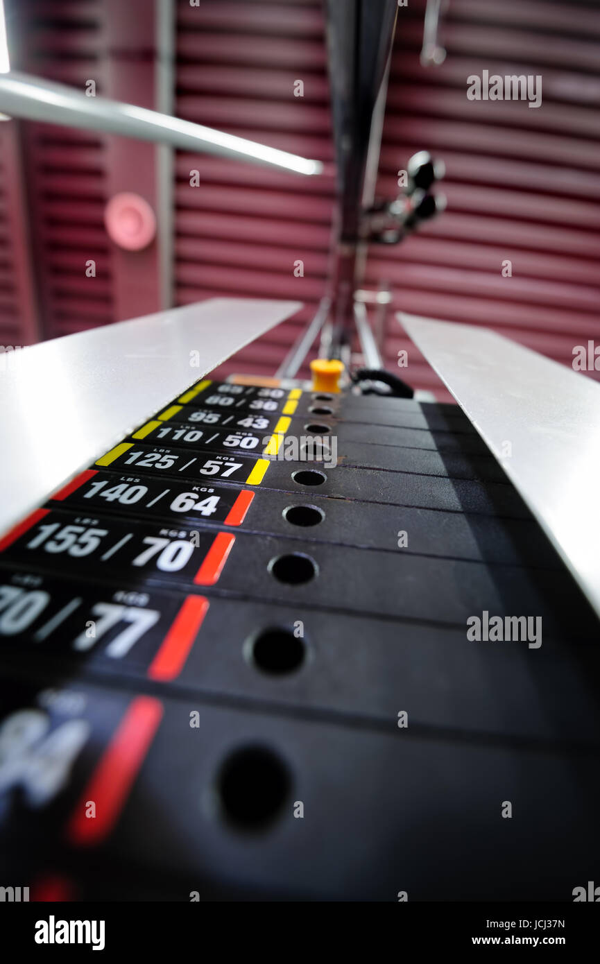 Weights in gym machine Stock Photo - Alamy