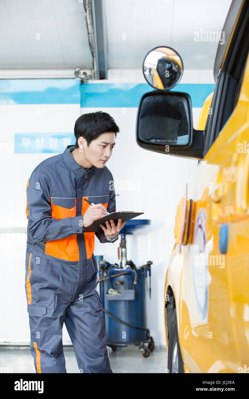 Young engineer at car mechanic Stock Photo Alamy