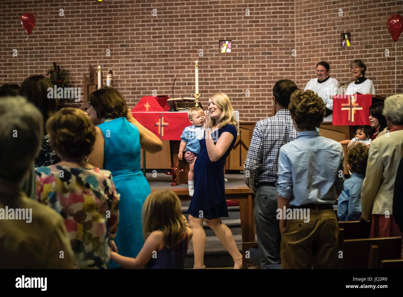 Church ceremony, baptism of young children. Parents, Grandparents ...