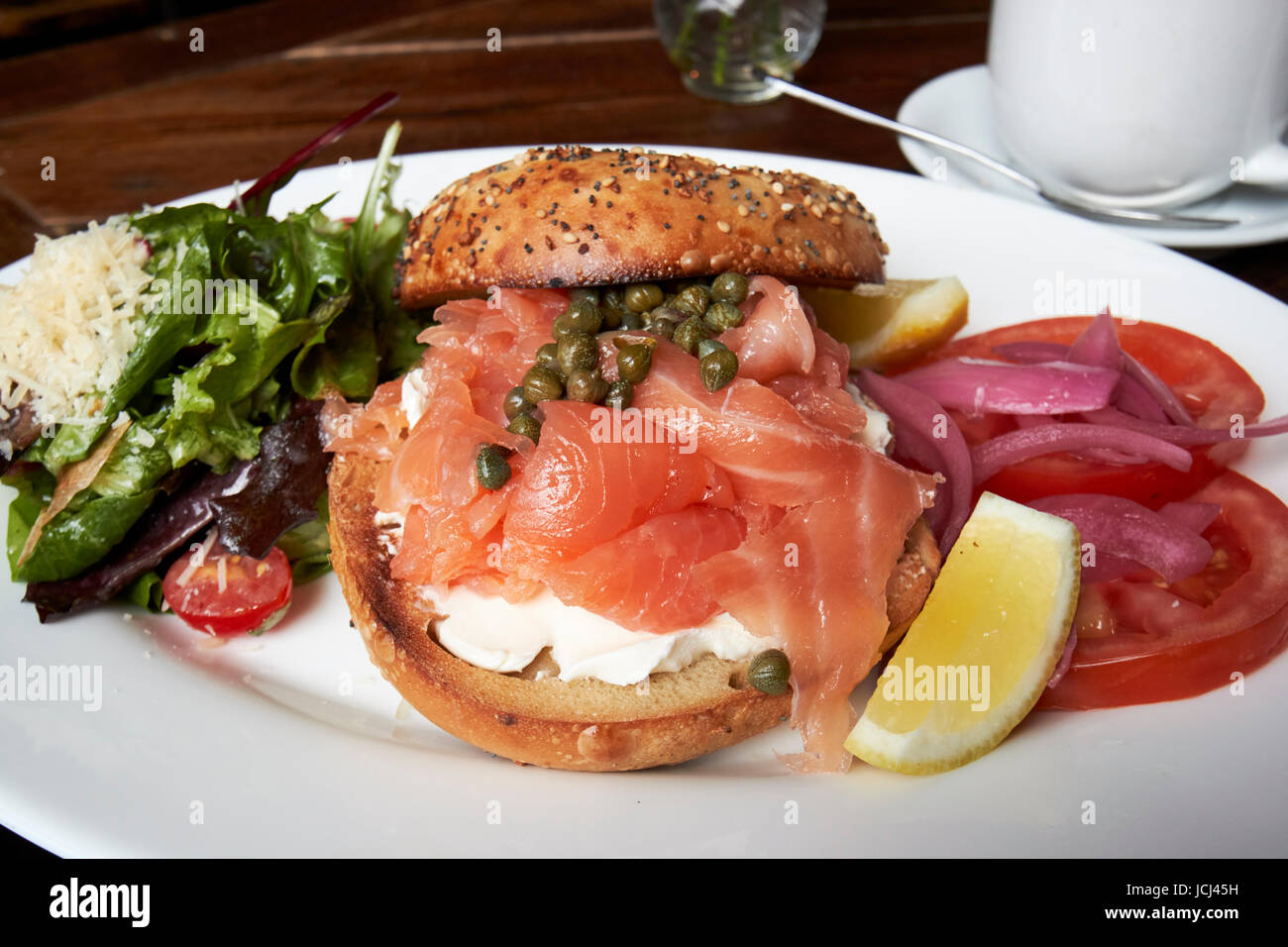 bagel with cream cheese and smoked salmon lunch with coffee in a