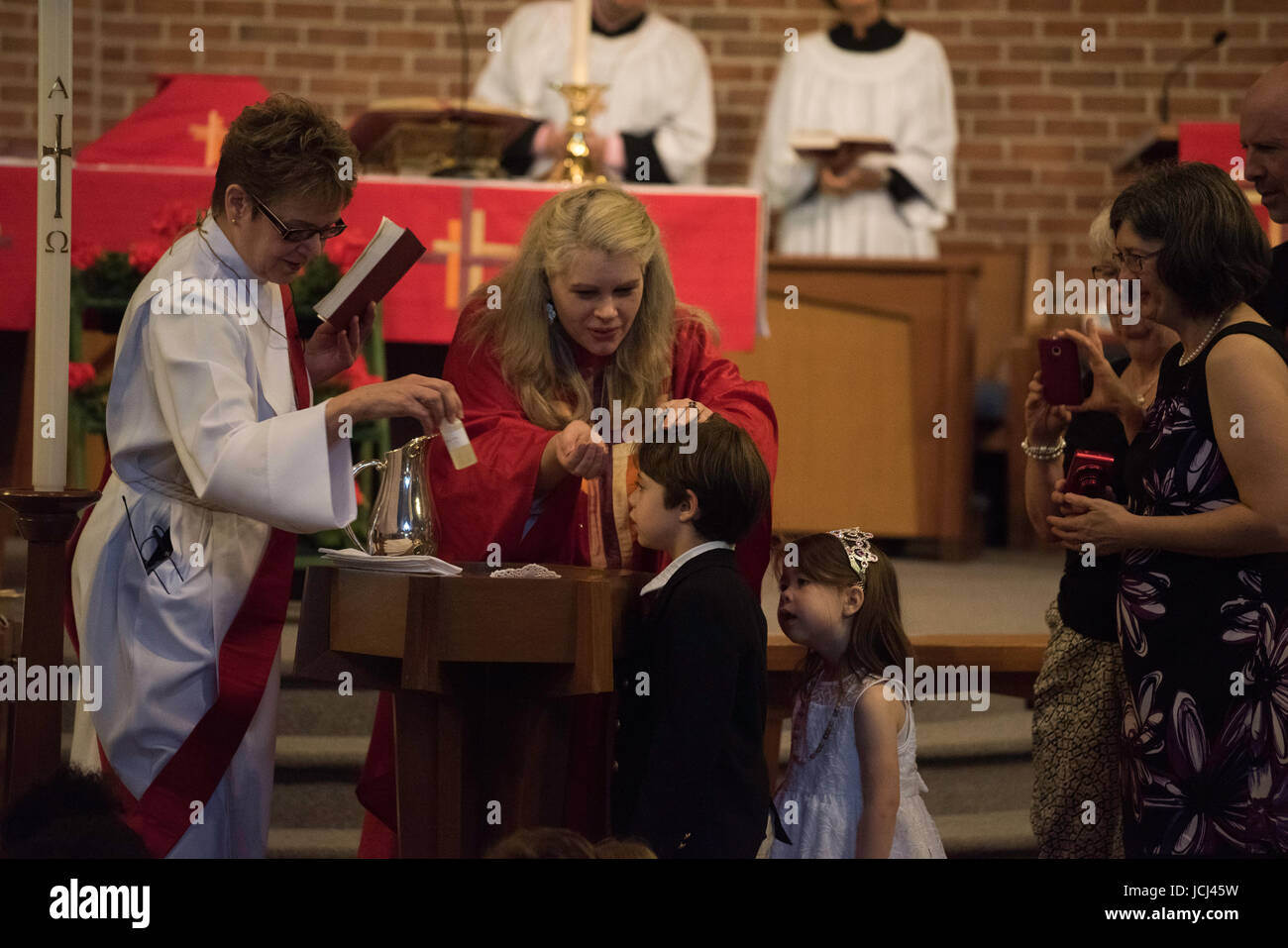 Church ceremony, baptism of young children. Parents, Grandparents ...